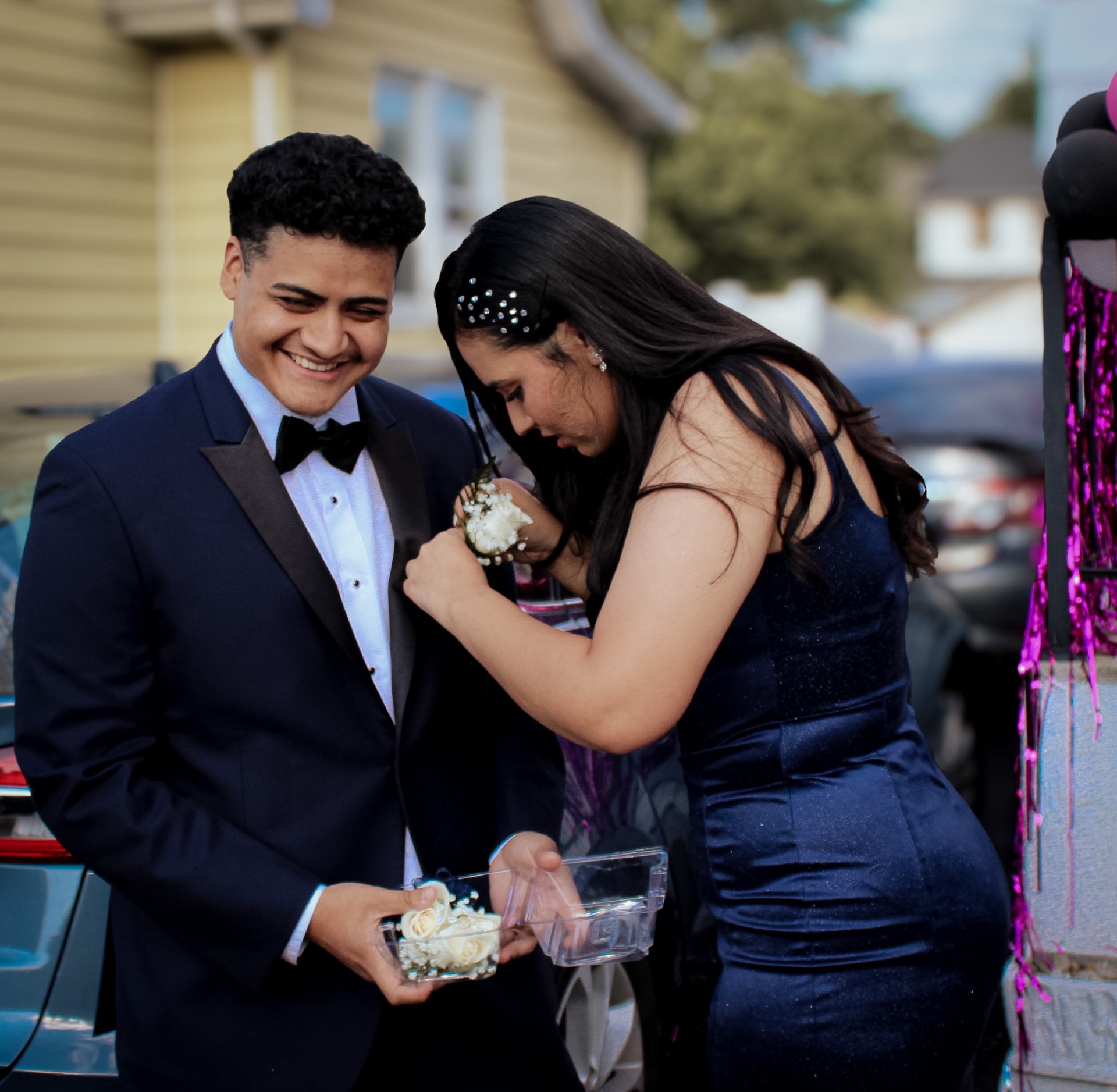 Pinning the corsage — quiet prom moment